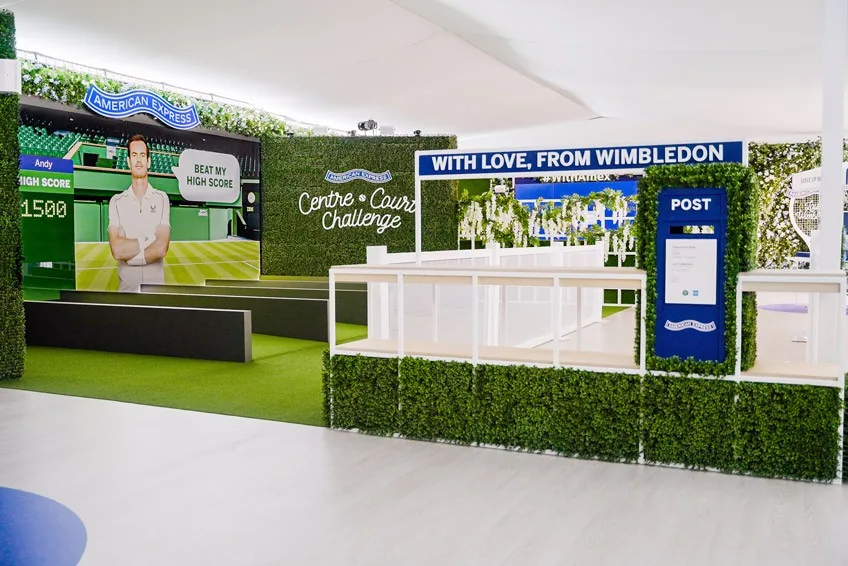 Centre Court Challenge inside the pavilion, with Andy’s high score on the screen and a With love, from Wimbledon postcard stand beside it