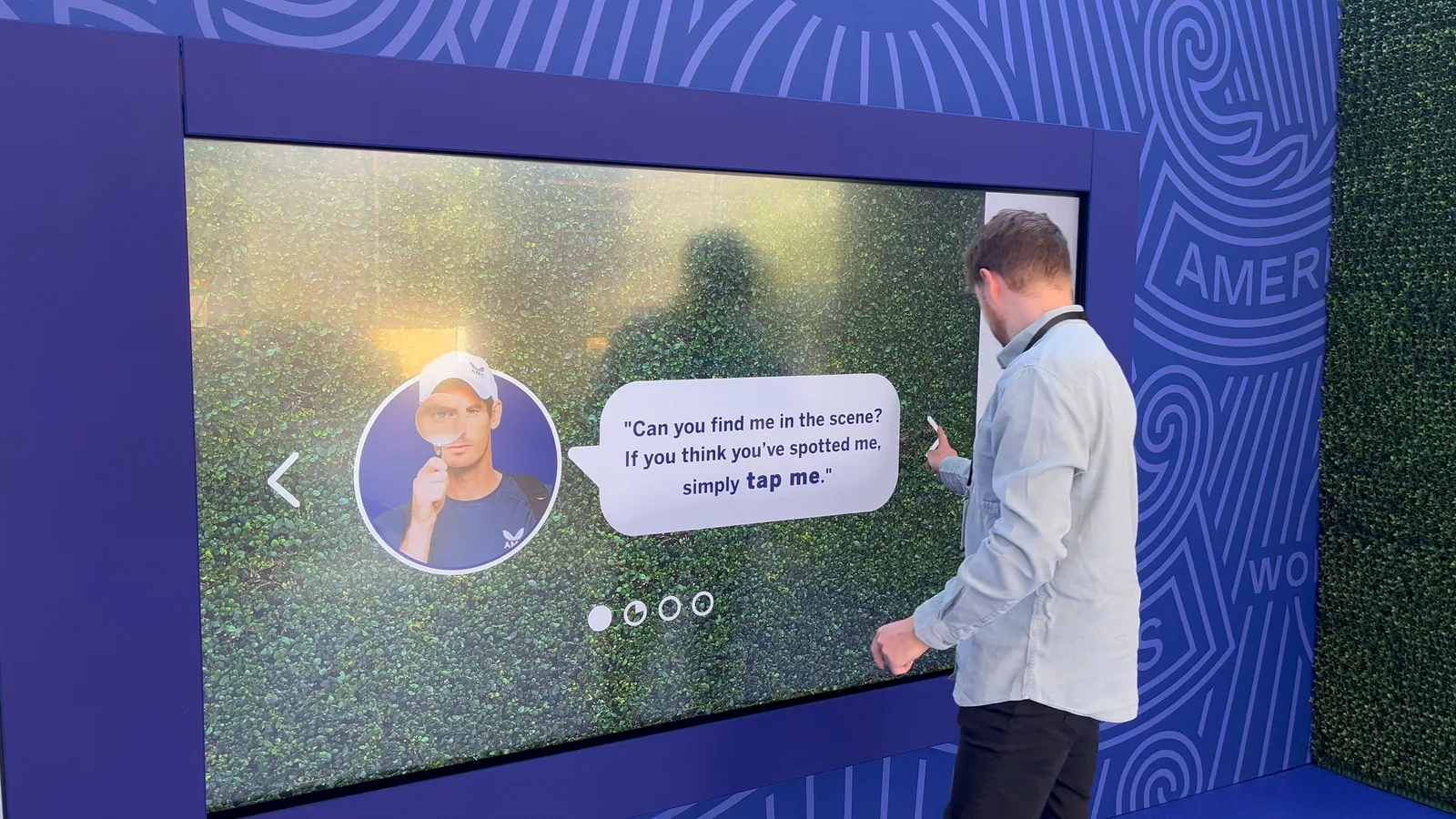 A player at the Find Andy touchscreen reading Andy Murray’s instruction: can you find me in the scene? If you think you’ve spotted me, simply tap me
